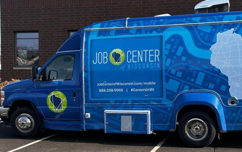 A Parked Blue Mobile Job Center truck.